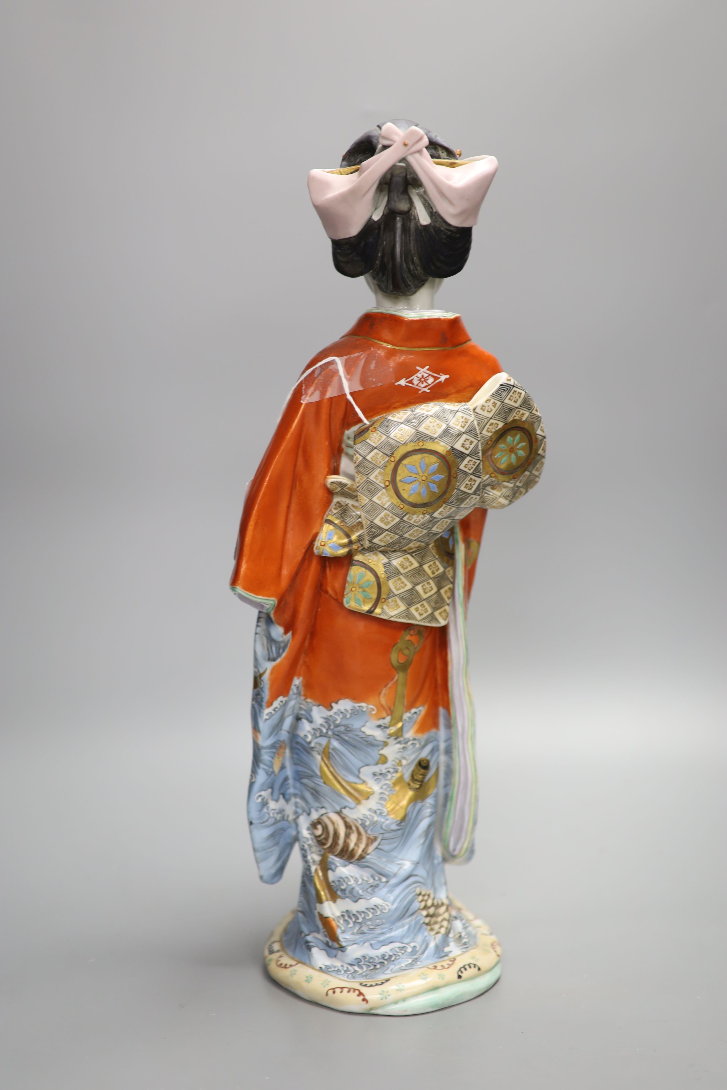 A large Japanese enamelled porcelain figure of a Geisha, early 20th century, height 46cm